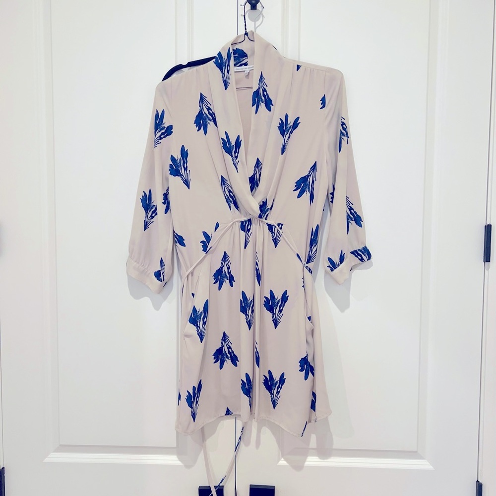 Pretty blue pattern on this tan blouse.